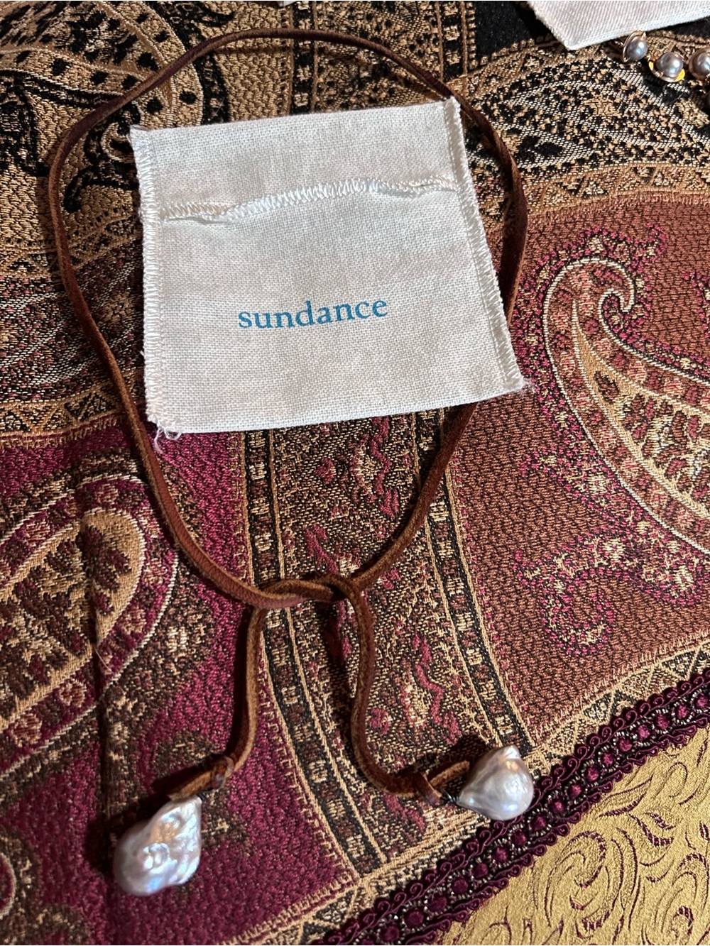 Sundance Ocean/Sea silvery gray pearls with an adjustable leather necklace.